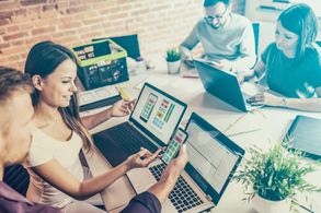 Web Designers drawing website ux app development. 